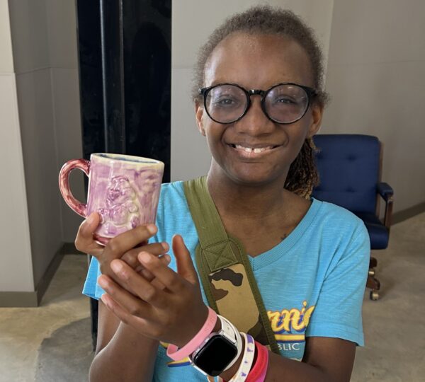 Camper with ceramic mug project at Camp Kamassa