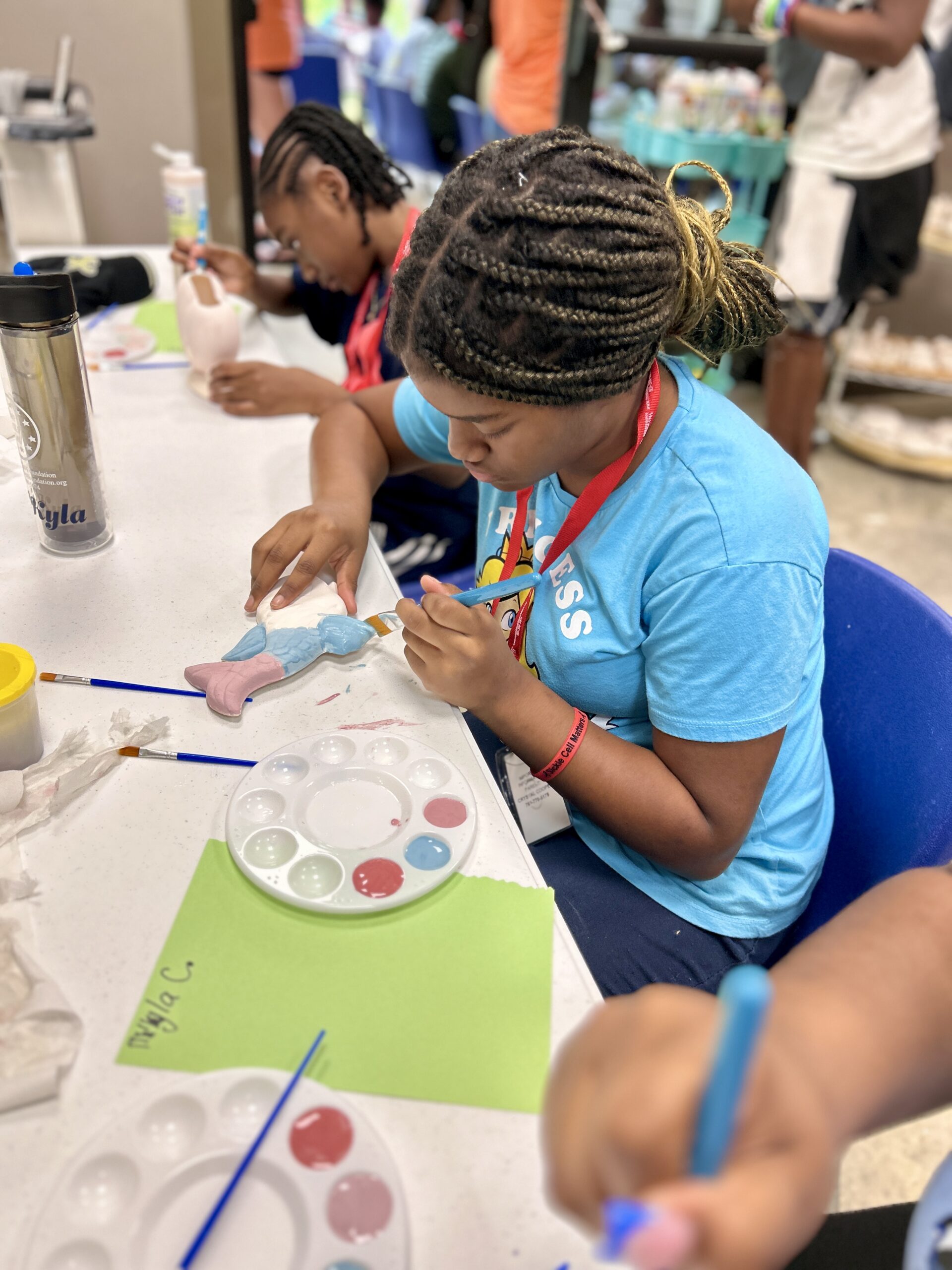 Kamassa camper participating in ceramics activity.