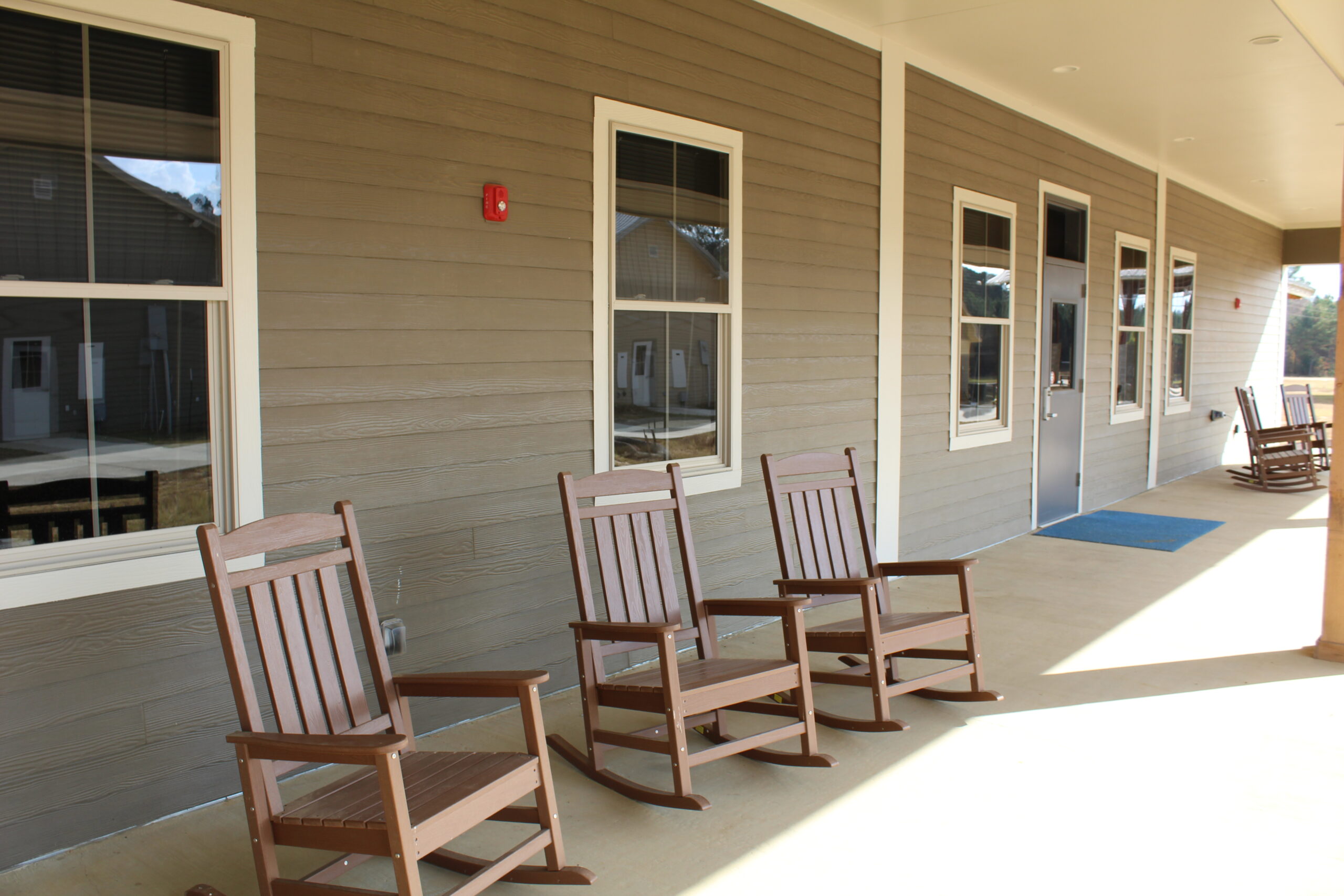 Front porch rocking chairs at Camp Kamassa infirmary.