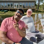 Campers enjoying seating on accessible pier at Camp Kamassa.
