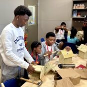 Campers making a birdhouses in the woodworking room at Camp Kamassa.