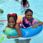 Campers enjoying the swimming pool at Camp Kamassa.