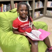 Camper reading in the library at Camp Kamassa.