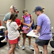 Families having medical check with med staff in Camp Kamassa's infirmary