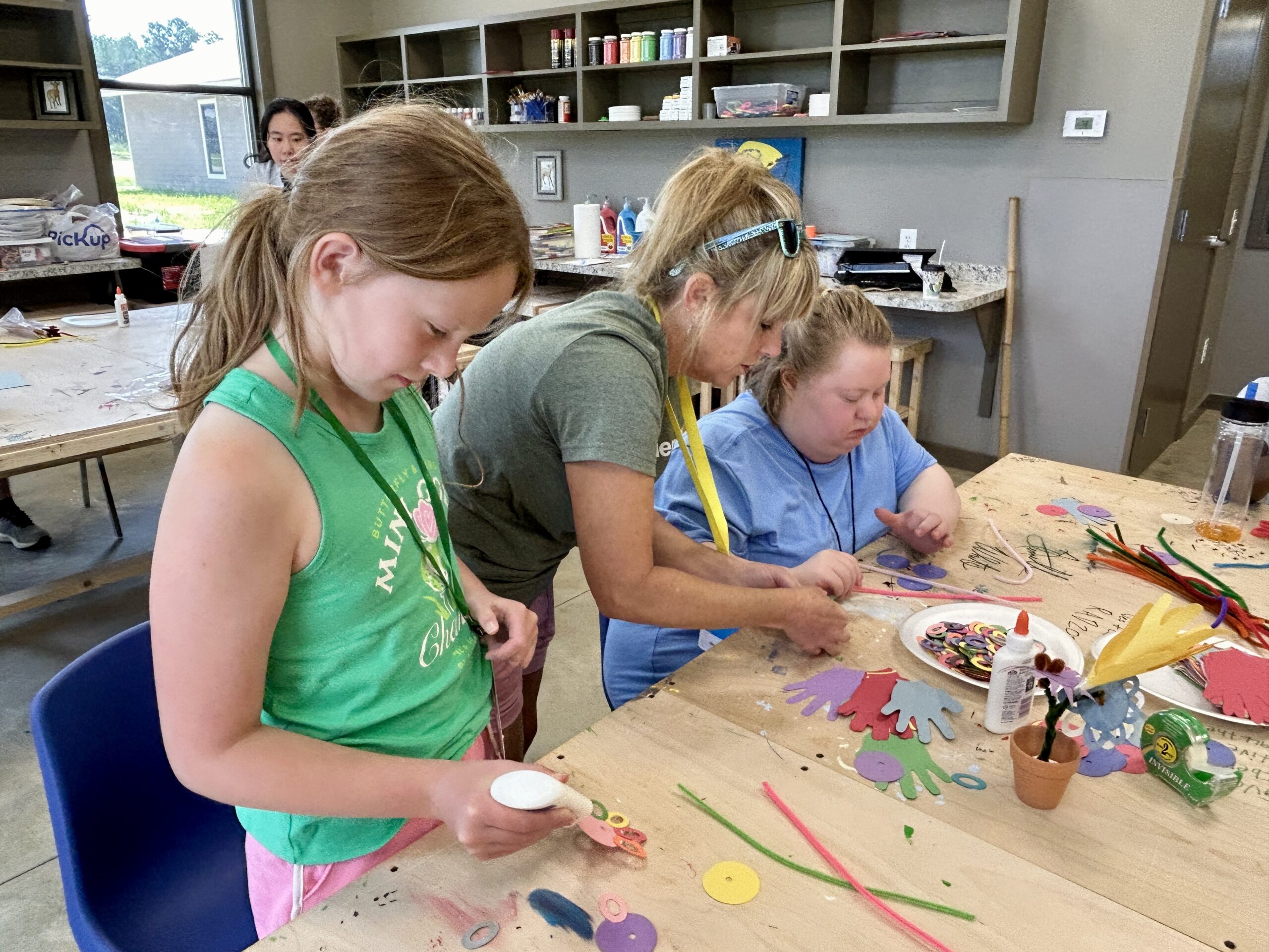 Campers enjoy making crafts in the arts & crafts room at Camp Kamassa.