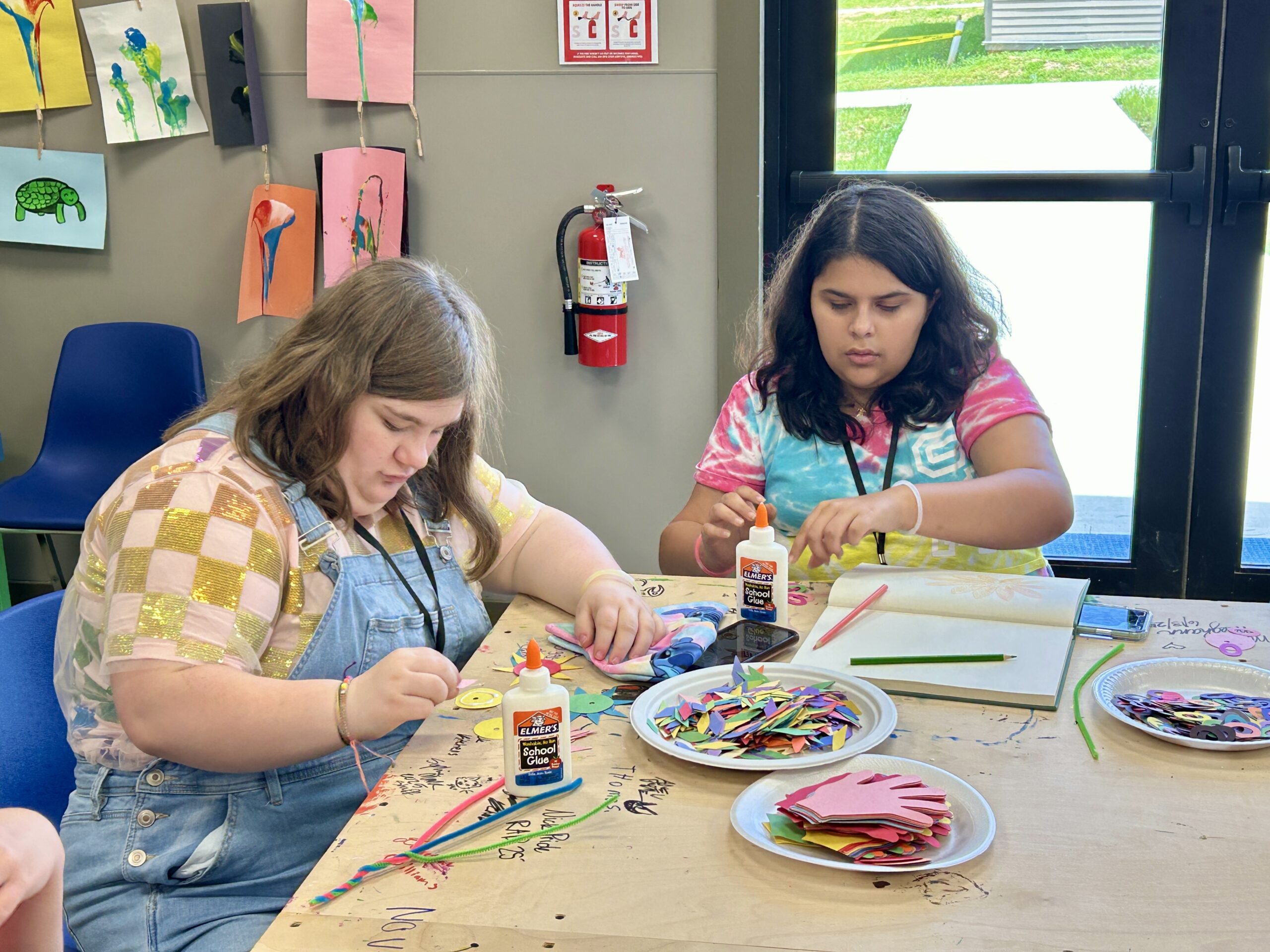 Campers enjoy making crafts in the arts & crafts room at Camp Kamassa.