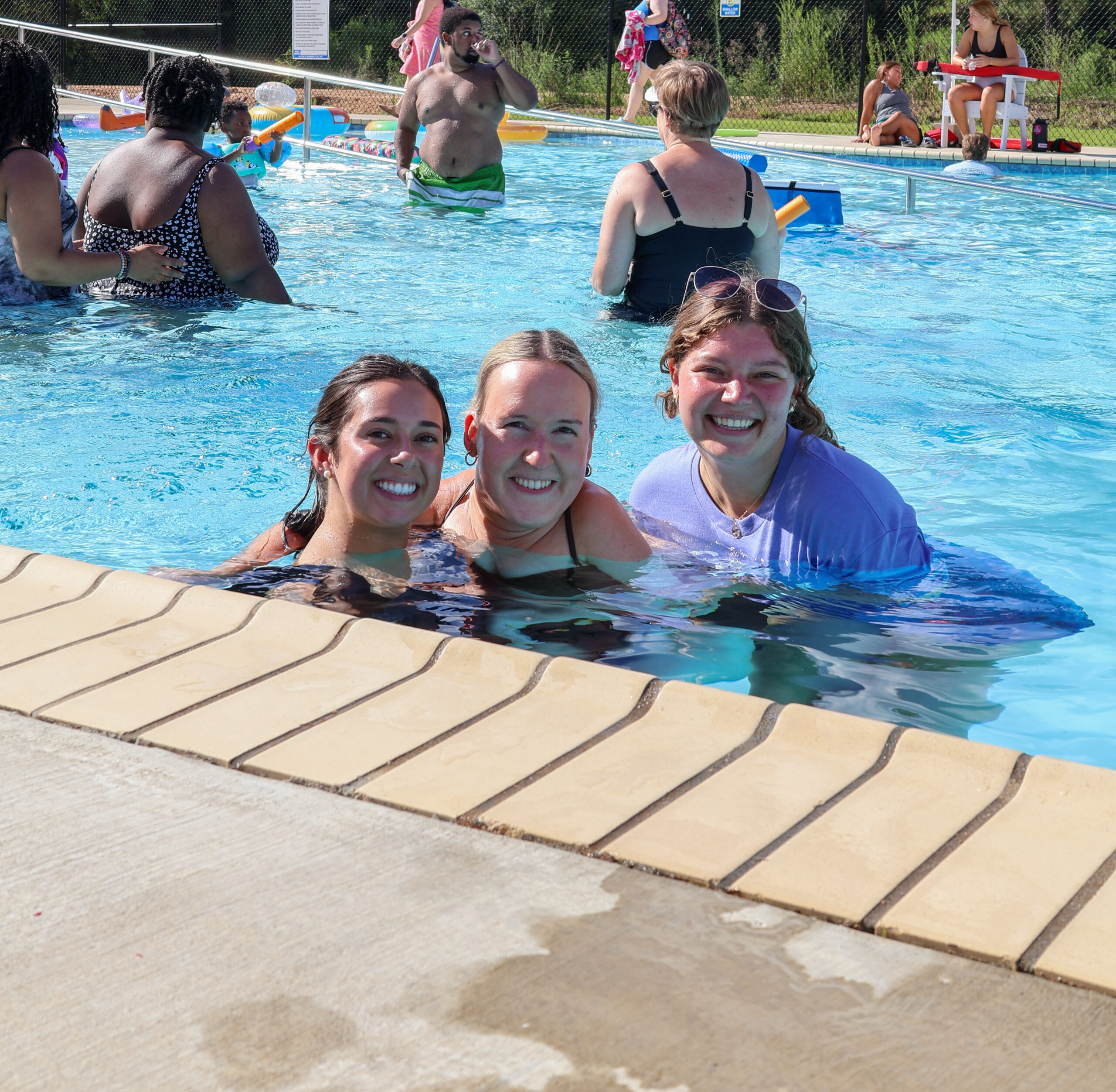 Guests cooling off in the pool at Camp Kamassa